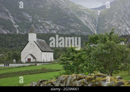 Eidfjord old church, an historic white Christian church, built in the 14th Century, on a beautiful s Stock Photo