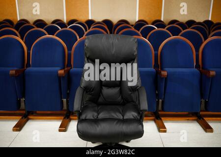 There are many chairs in a row in the Assembly hall. Meeting or conference room. Stock Photo