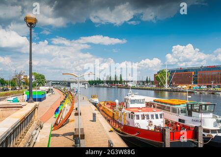 Boats docked on Wieleckie Quay and long promenade, view from Long Bridge, called Most Dlugi in Szcze Stock Photo