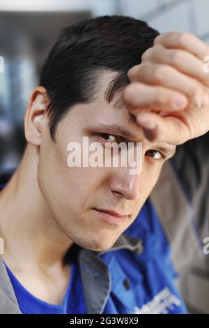 Pensive portrait of a young employee in close-up. Stock Photo