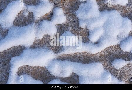 Snow patterns in the sand. Stock Photo