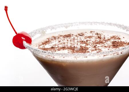 Alcoholic cocktail - baileys with vodka, milk and chocolate chips. Alcoholic cocktail in a glass on a white background. Isolated Stock Photo