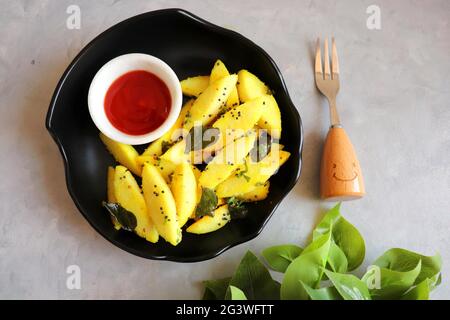 Tea time food - Masala idli or tadka fried idly is a very tasty dish made out of leftover idlis. best to eat as a Breakfast or snacks. Stock Photo