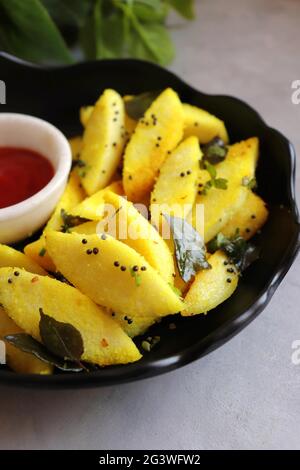 Tea time food - Masala idli or tadka fried idly is a very tasty dish made out of leftover idlis. best to eat as a Breakfast or snacks. Stock Photo