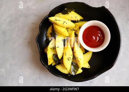 Tea time food - Masala idli or tadka fried idly is a very tasty dish made out of leftover idlis. best to eat as a Breakfast or snacks. Stock Photo