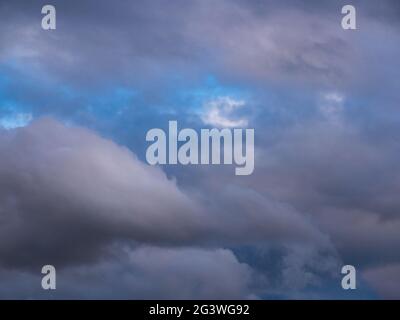 Dramatic clouds before sunset - fluffy like cotton candy Stock Photo
