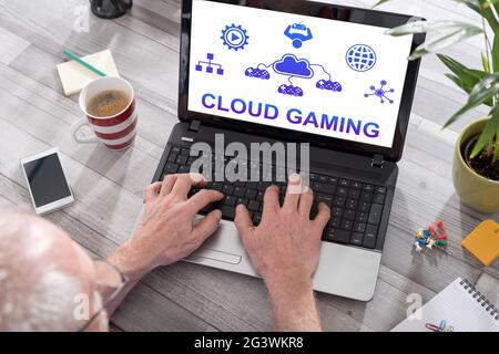 Cloud gaming concept shown on a laptop used by a man Stock Photo