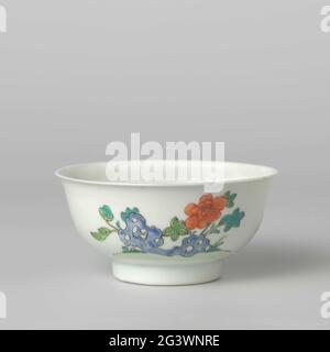 Bell-Shaped Bowl With Flower Sprays and a Flowering Plant Near a Rock. Bell-shaped bowl of porcelain, painted in underglaze blue and on the glaze blue, red, green, yellow, black and gold. On the outer wall on one side a chrysantheate branch and a bamboo roof, the other side with a blossoming peony plant at a rock. Marked on the underside with a seal mark in a double circle. A chip in the edge; Some chips in the bottom. Famille Verte. Stock Photo