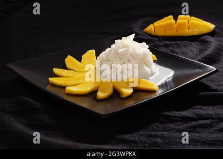 Famous Thai dessert, Mango with sticky rice and coconut milk. Stock Photo