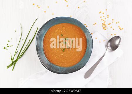 Delicious homemade soup from organic red lentil, vegetable and garlic. Stock Photo