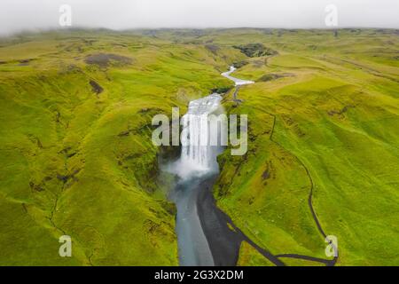 Iceland. Aerial view on the Skogafoss waterfall. Landscape in the Iceland from air. Famous place in Iceland. Landscape from drone. Travel concept Stock Photo