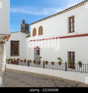Spanish architecture style buildings with whitewashed walls and flower pots Stock Photo