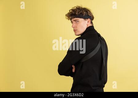 Portrait of sad resentful young man in standing and looking at camera with dissatisfied sadness face Stock Photo