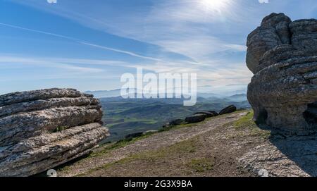 A landscape view of the el Torcal rock formations and the Montes de Malaga Nature Park in Andalusia Stock Photo
