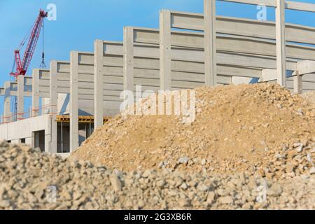 Construction site with crane, shell and building material Stock Photo