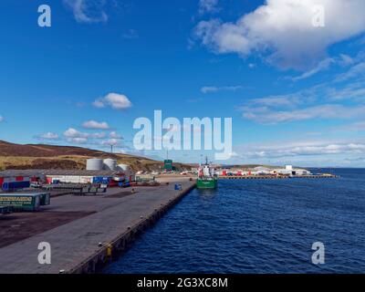 Peterson Quay at the Greenhead Base in the Shetland Islands with the Thun Grace Tanker moored alongside a deserted and tidy quay, Stock Photo