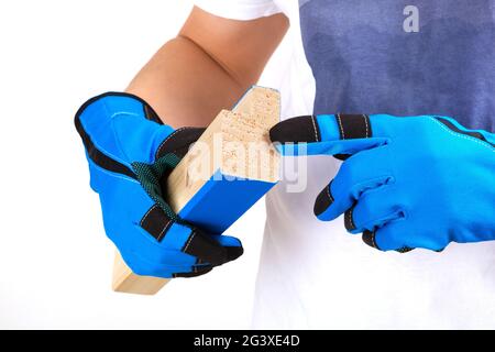 Handsome craftsman holding a piece of wood. Stock Photo