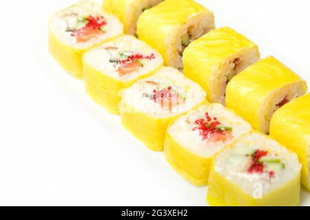 Large set of Japanese rolls on a black background. Salmon, tuna, smoked eel. Close-up, top view. Food delivery concept. Stock Photo