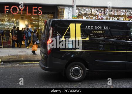 An Addison Lee courier van outside Foyles bookshop on Charing Cross Road, London Stock Photo