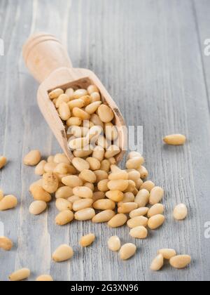 Pine nuts on gray wooden background Stock Photo