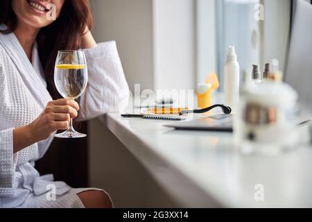 Relaxed woman preparing for her beauty procedure Stock Photo