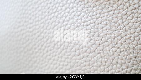 Leather texture background. Light beige ecru imitation leather sample. Abstract background with copy space, top view Stock Photo