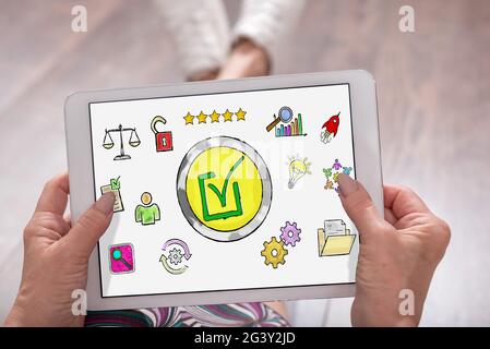 Validation concept shown on a tablet held by a woman Stock Photo