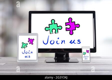 Cooperation concept shown on different information technology devices Stock Photo