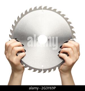 Female hands with black nails manicure with circular saw blade. Stock Photo