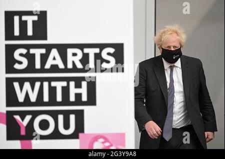 Prime Minister Boris Johnson enters the arts and craft area during a visit to Kirklees College Springfield Sixth Form Centre in Dewsbury, West Yorkshire. Picture date: Friday June 18, 2021. Stock Photo