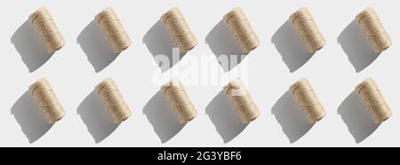 String rope twine isolated pattern on white background. Jute rope for packing and decoration, skein of brown wool for knitting. Linen rough threads Stock Photo