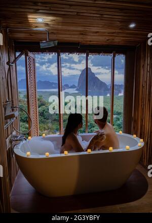Couple in love spending time together in the house. Romantic moments in the bathroom on vacation at Phangga Thailand