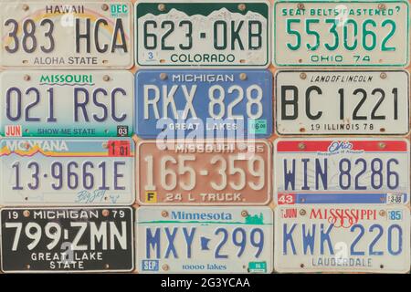 Drempt, The Netherlands - September 5, 2019: Retro styled image of old car license plates on a wall in Drempt, The Netherlands. Stock Photo