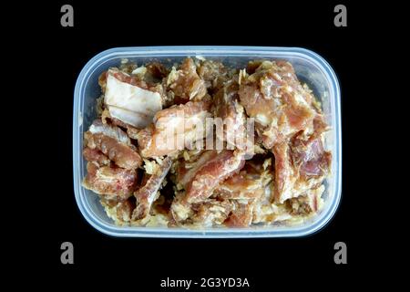 Fresh pork ribs mix with garlic and pepper on black background. Stock Photo