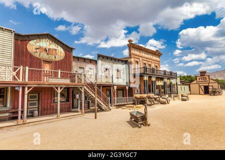 Vintage Far West town with saloon. Old wooden architecture in Wild West. Stock Photo