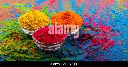 Colorful traditional holi powder in bowls. Happy holi. Concept Indian color festival called Holi. Organic Gulal dust Stock Photo