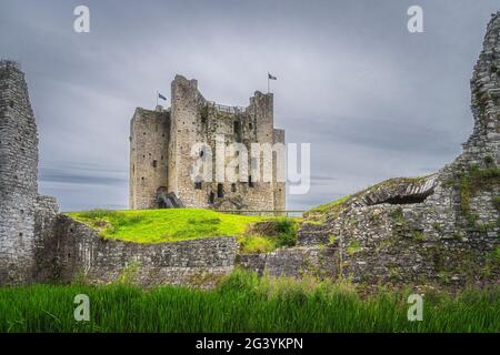 View on Trim Castle through a gap between fortification walls Stock Photo