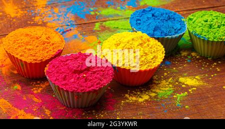 Colorful traditional holi powder in bowls. Happy holi. Concept Indian color festival called Holi. Organic Gulal dust Stock Photo