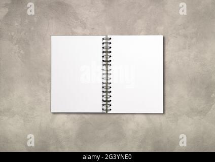 Blank open spiral notebook isolated on concrete background Stock Photo
