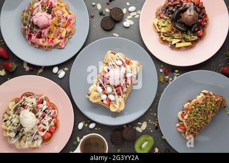 Three different waffles in square, heart and bubble shape. Stock Photo