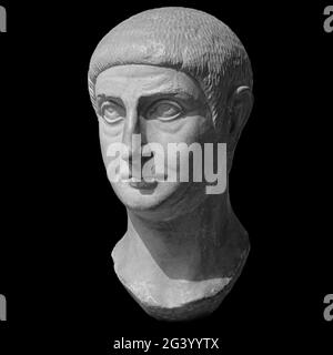 Head detail of the ancient man sculpture. Stone face isolated on black background. Antique marble statue of mythical hero charac Stock Photo