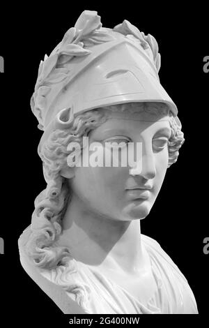 Ancient Greek goddess Athena Pallas statue isolated on black. Marble woman head in helmet sculpture. Stock Photo