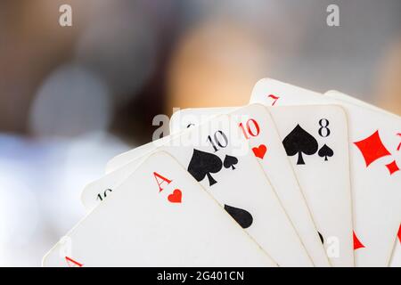 Playing cards: Poker cards in the hand of a man Stock Photo