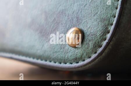 Detail of a fashionable leather bag close up. Fashion concept. Details of sewing threads, macro photography. Stylish female accessory Stock Photo