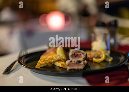 Plate of fish appetizer in the Arii Vahine restaurant of the Hilton Moorea Lagoon Resort & Spa, Moorea, Windward Islands, French Polynesia, South Paci Stock Photo