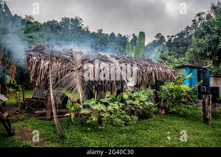 Cooking hut with smoke, Efate, Vanuatu, South Pacific, Oceania Stock Photo