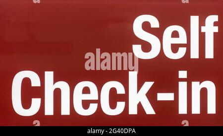 Self service check in sign at airport Stock Photo