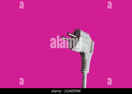 Electric plug closeup on pink background Stock Photo