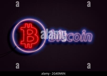bitcoin text and logo neon sign on the wall, abstract crypto currency money concept Stock Photo