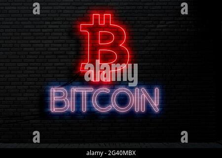 bitcoin text and logo neon sign on the wall, abstract crypto currency money concept Stock Photo